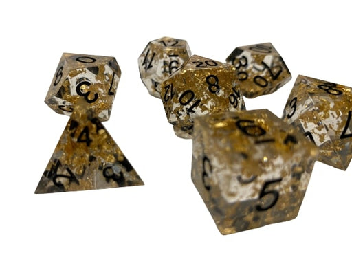 Glimmer of Hubris- Translucent with Gold Flecks inclusions with Black Numbering 7pc Sharp-Edge Dice Set