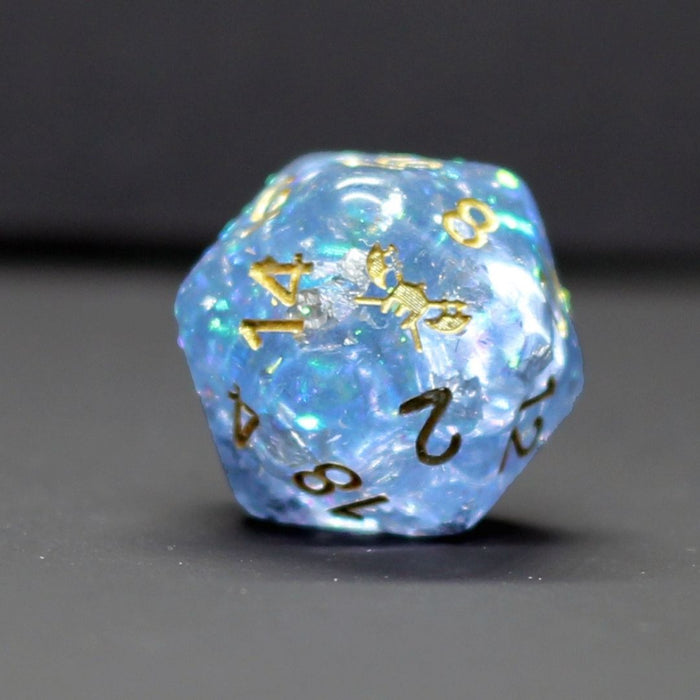 Snowmaiden's Kiss™️ - Light Blue with Foil Inclusions and Gold Numbers Dice Set